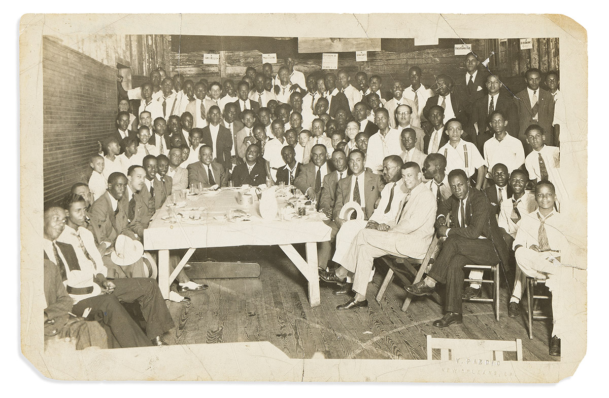 (ENTERTAINMENT--MUSIC.) Photograph of Louis Armstrong being honored by New Orleans musicians at the Astoria Hotel.